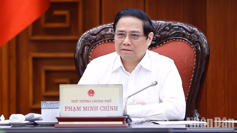 Премьер-министр Фам Минь Тьинь на заседании. Фото: Чан Хай