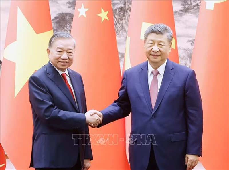 vna-potal-tong-bi-thu-chu-tich-nuoc-to-lam-va-tong-bi-thu-chu-tich-nuoc-tap-can-binh-chung-kien-le-ky-cac-van-kien-hop-tac-giua-hai-nuoc-stand-2.jpg